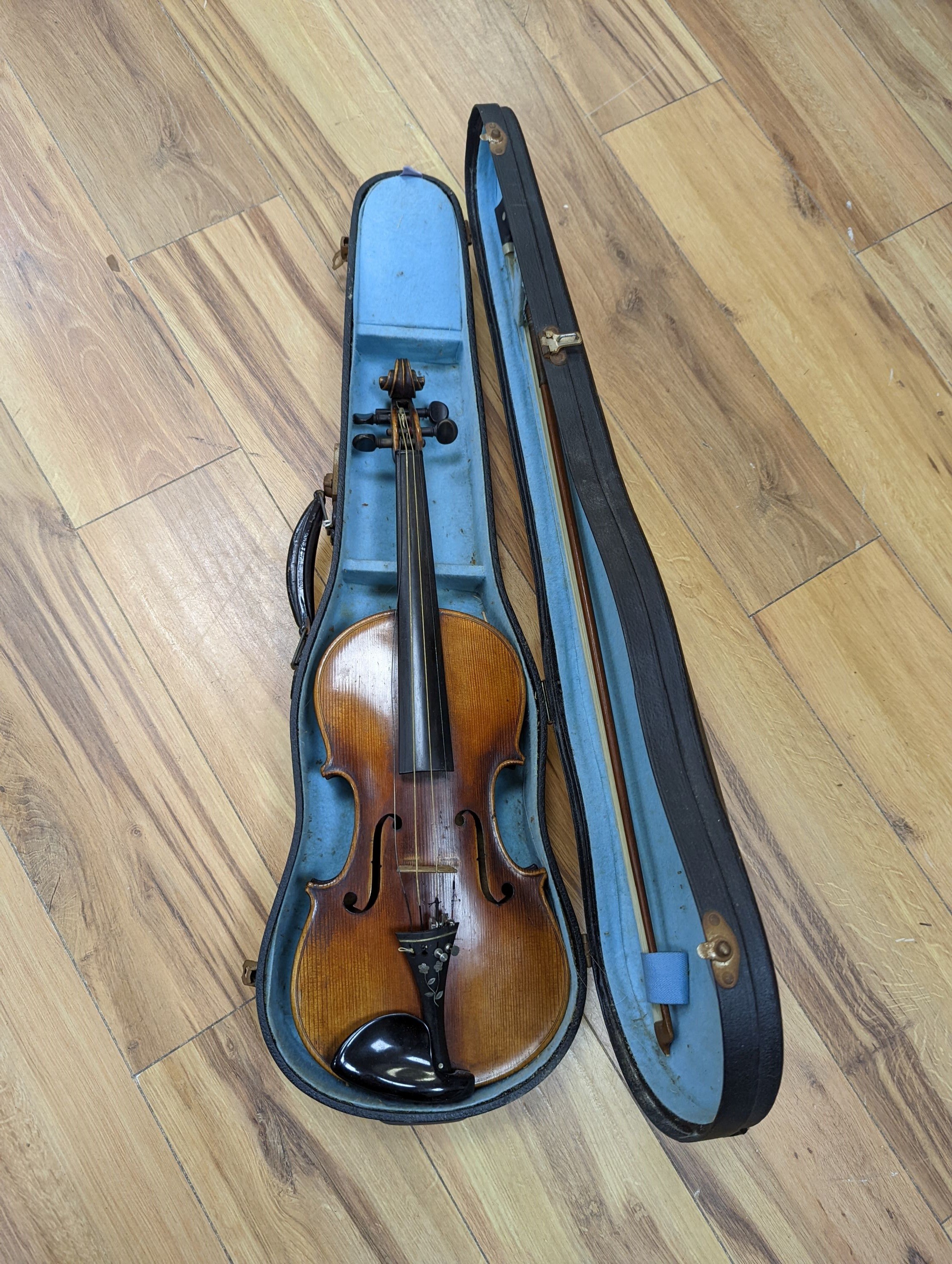 A late 19th century German violin, case, 60 cms long.
